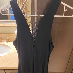 Little black dress w  lace up in front and back. MIDI length